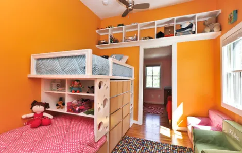 Storage solutions in orange bedroom
