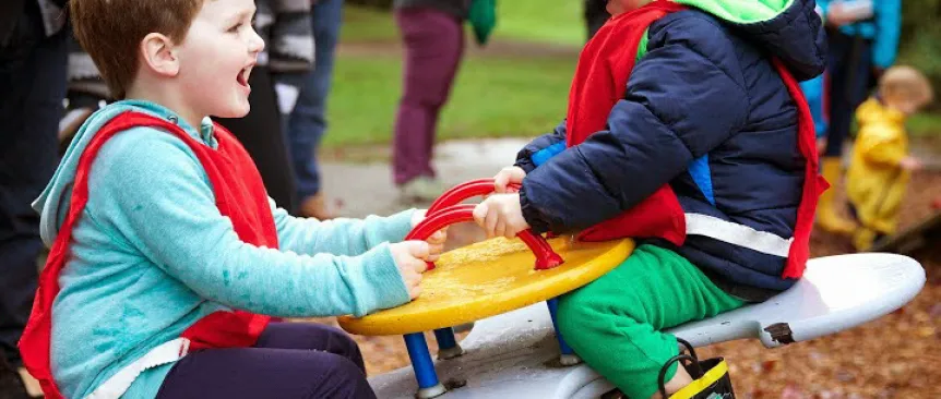 Kids playing in park at a co-op preschool near Seattle