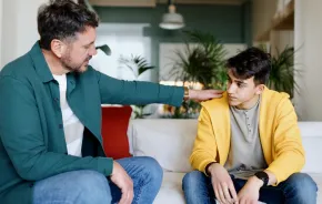 Dad supporting his teenage son with mental health stigma