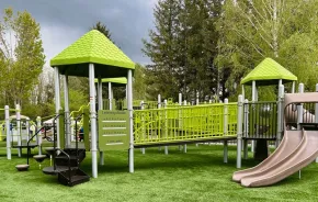 New playground structures at Centennial Fields Park in Snoqualmie offer mountain views and accessible play.