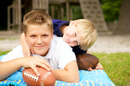 boys playing football