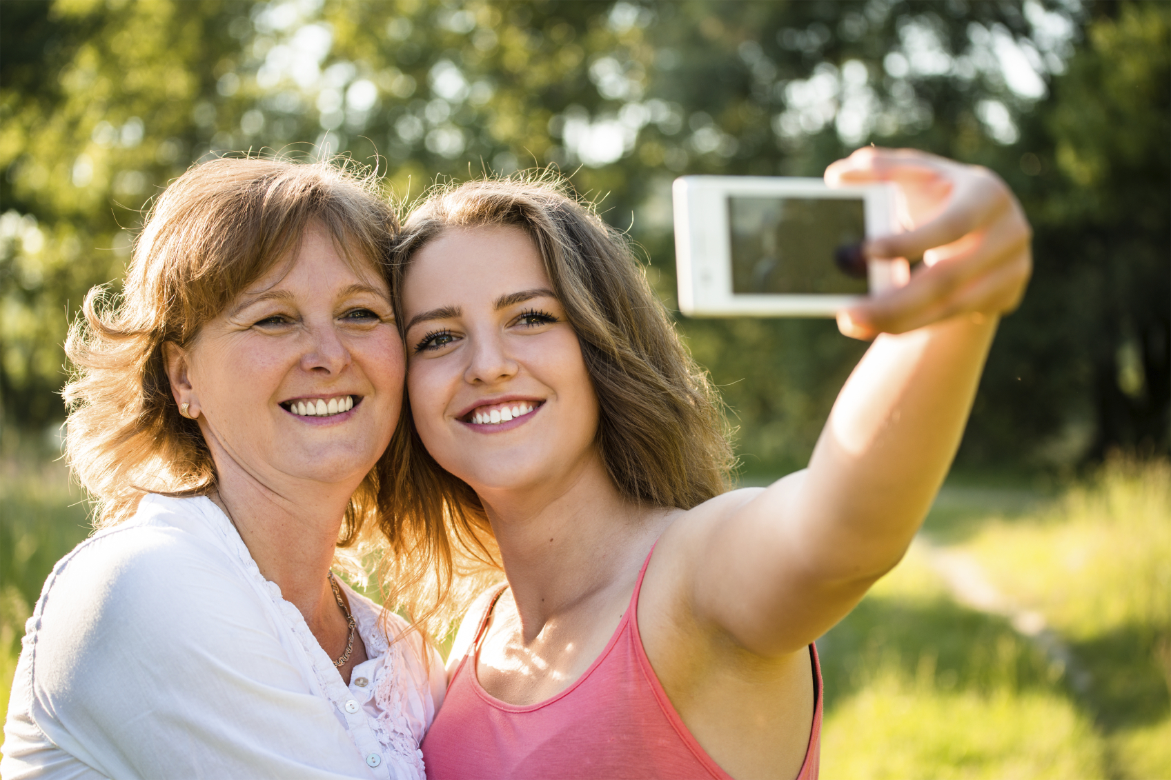 Two Women Mother And Daughter Making Selfie By Smartphone At Park Stock ...