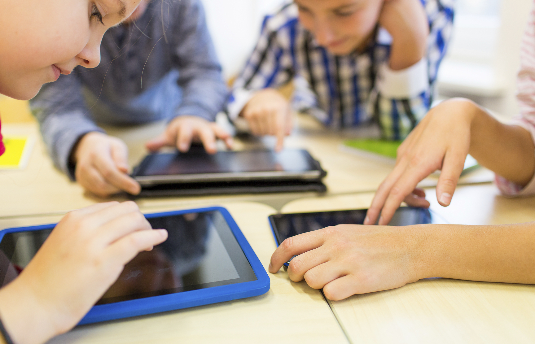 students looking at tablets