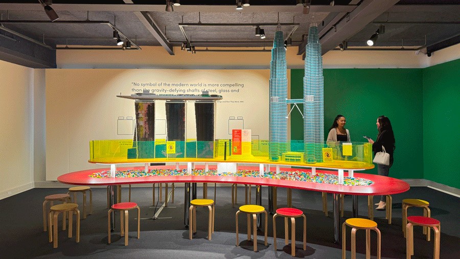 The tables at the Lego exhibit in Mohai with stools and display buildings