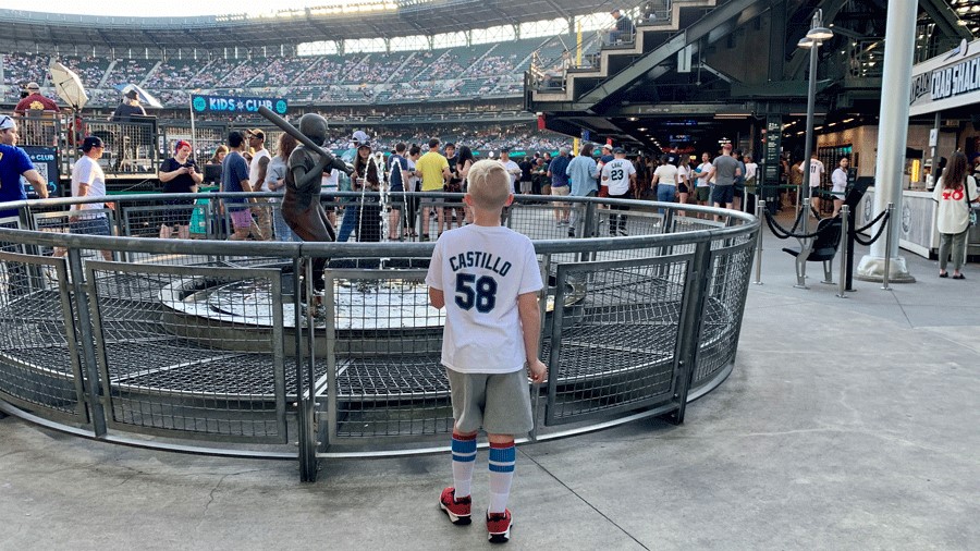 Boy at T-Mobile Park looking at crowd outside of the Kids Club