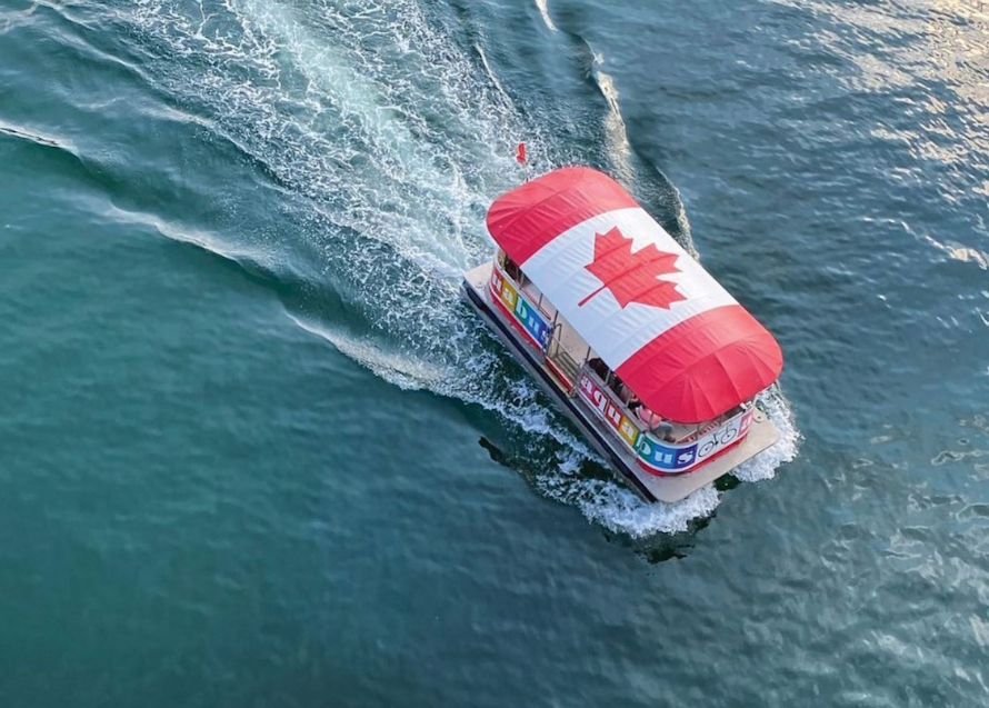 "Aquabus with a large Canadian flag on the roof"