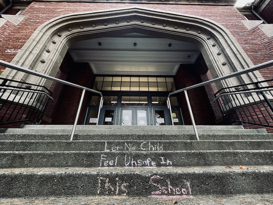 "Let no child feel unsafe in this school." Chalk on the main entrance stairs of Lincoln High School