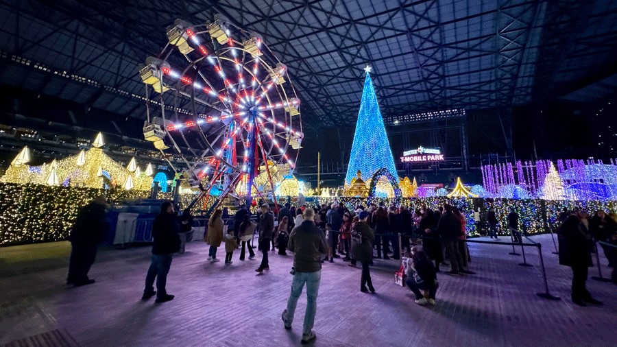 Brightly lit Ferris wheel at Enchant Christmas, a holiday attraction for Seattle families