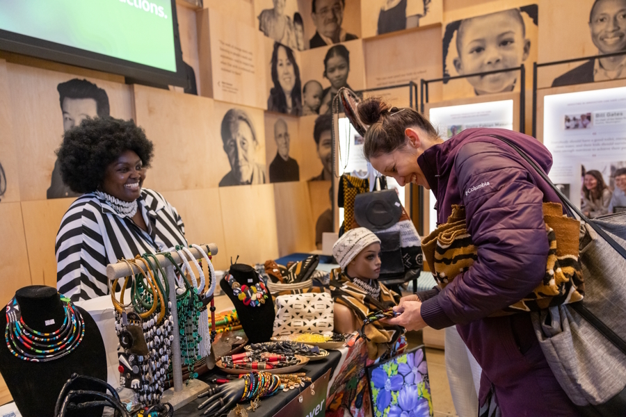 Women shopping at the Giving Marketplace holiday market