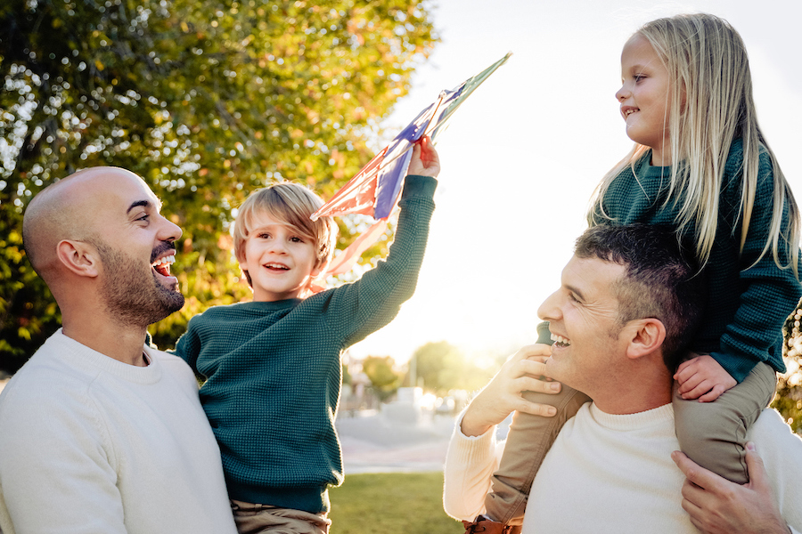 happy kids with their dads outside