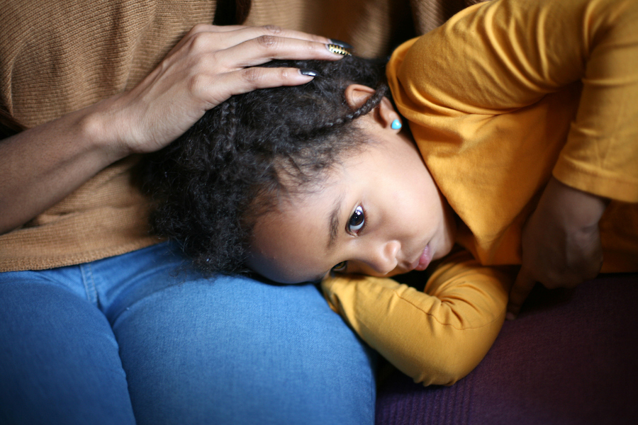 anxious child soothed by mom