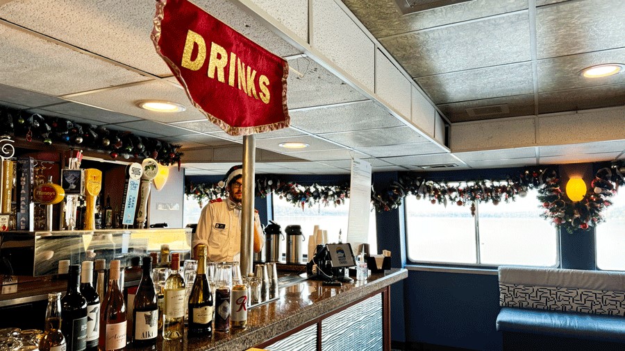 Festive decorations on the Argosy Christmas Ship bar with cocktails and mocktails available for purchase