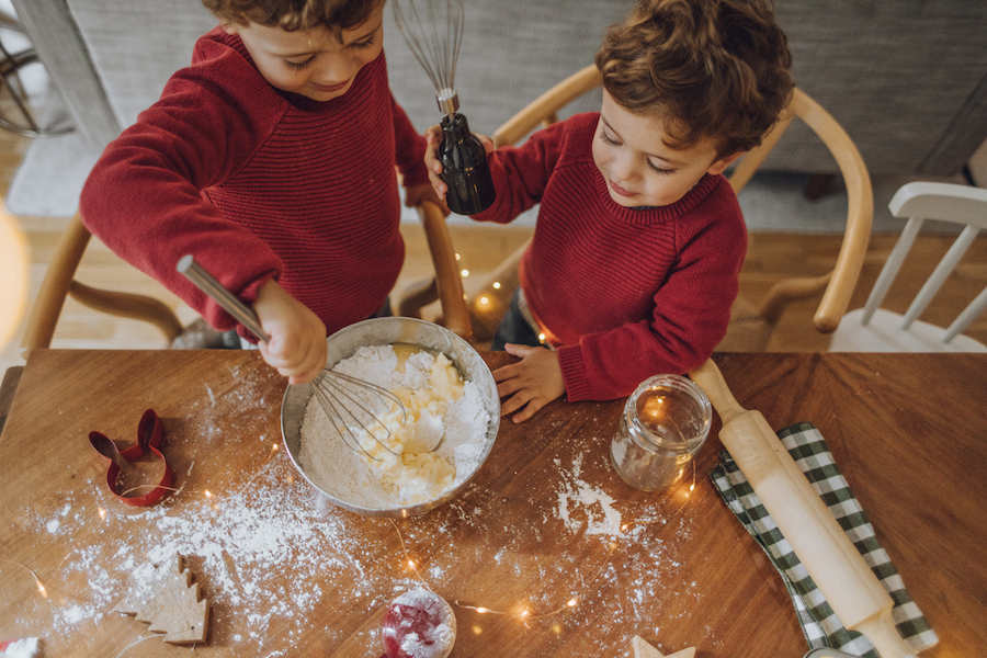 kids making gingerbread houses in a birds-eye-view holiday photo