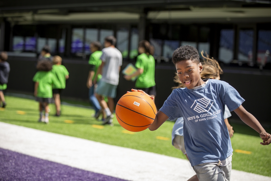 boy playing basketball with the Boys and Girls Clubs