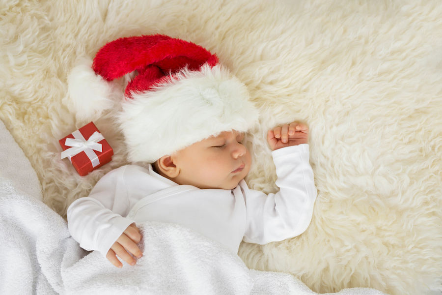 sleeping baby in a santa hat