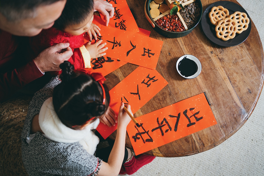 children working on a cultural family holiday tradition