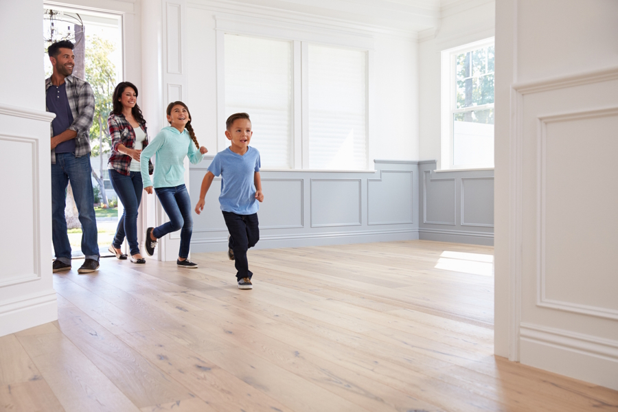 Family running into a new affordable home in Seattle