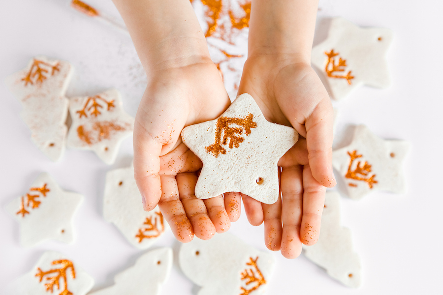 salt dough ornaments in a child’s hands