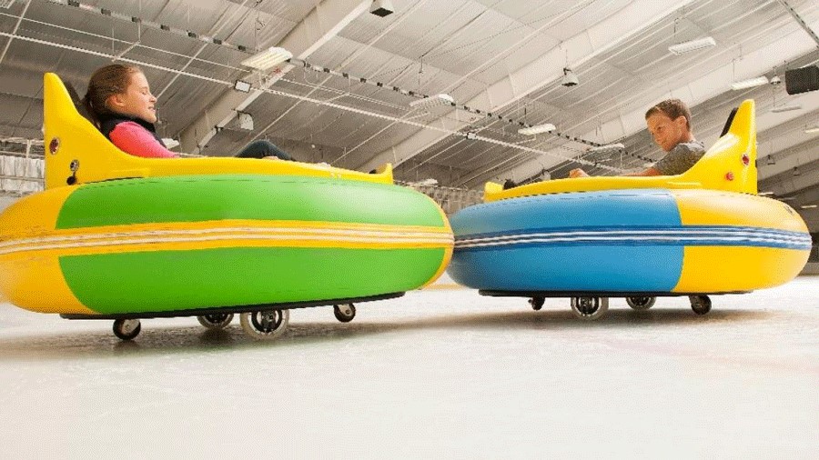 Kids playing ice bumper cars at Sprinker Recreation Center in Tacoma, a family-friendly indoor activity for rainy days