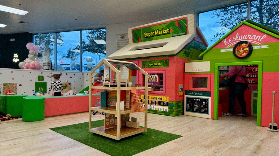 restaurant, toddler play space and imaginative dollhouse at Little Pandas Play Cafe in Everett, a new indoor playground for families