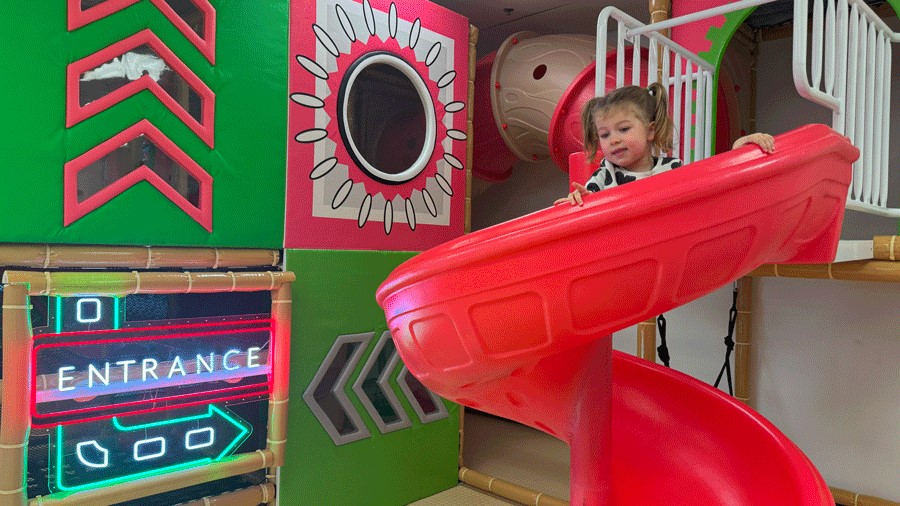 bright pink slide at Little Pandas Play Cafe in Everett, a new indoor playground