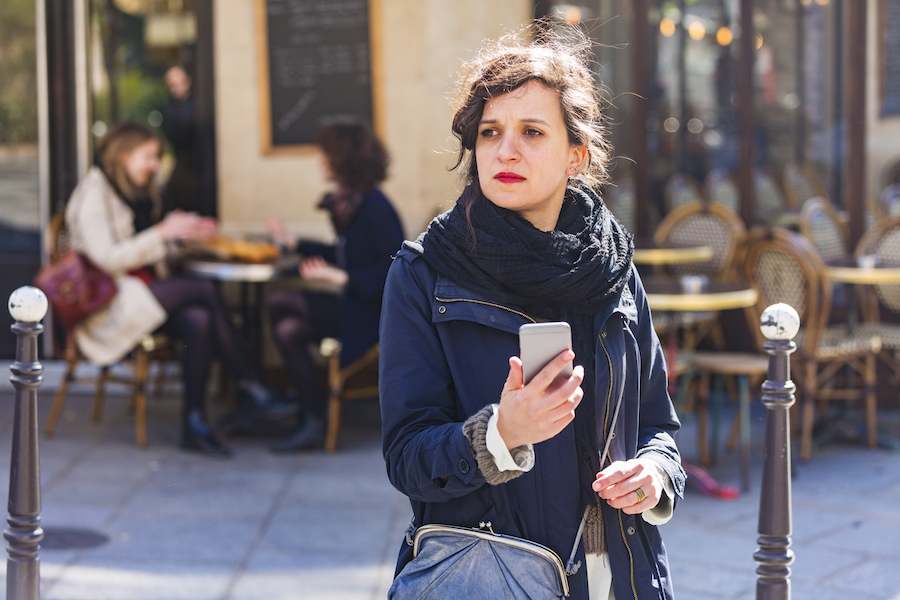 woman in black jacket and red lipstick in Paris