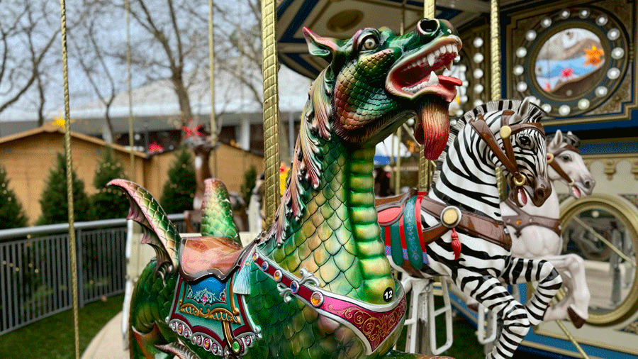 detail of dragon figure on Seattle Christmas Market double-decker carousel