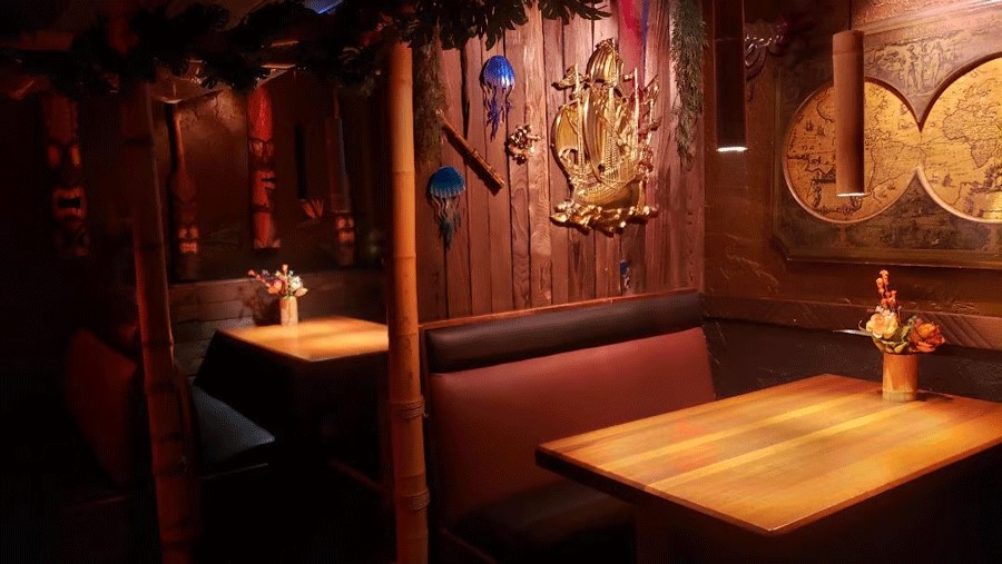 Interior of the cozy Da Tiki Hut in Tacoma, a restaurant serving comfort food and Polynesian food