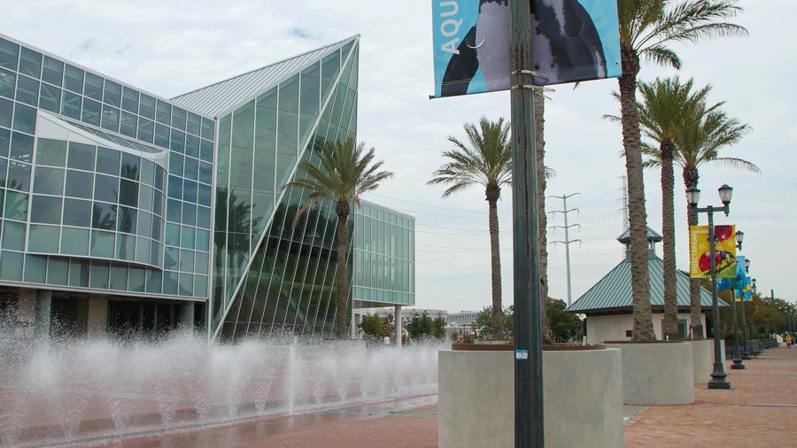 Exterior of the Audubon Aquarium and Insectarium in New Orleans with a splash pad for warm days