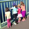 Kids standing on the Tacoma Narrows Bridge looking over, an easy Tacoma hike
