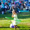 Girl plays with hula hoop at a Seattle summer concert on a sunny day