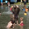 Families enjoying the wading pool at Seattle's Green Lake Park. Wading pools open June 22, 2024.