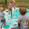 kids doing a messy art project outside