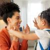 mom and child say goodbye as the child goes back to school