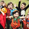 children trick or treating in Halloween costumes