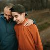 dad and teen son on a walk outside