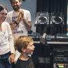 A young music fan takes the mic for Kids Day on the Morning Show at KEXP. Photo: Melissa DeAun for KEXP