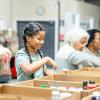 Girl organizing food donations during the holidays