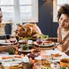 Family eating Thanksgiving dinner from a Seattle-area restaurant serving Thanksgiving dinner and takeout