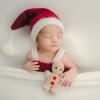 sleeping baby wearing a santa hat for a sweet and easy holiday photo