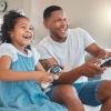 dad and daughter play video games