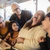 A family laughing and enjoying time together on Thanksgiving 