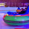 A kid spins in an ice bumper car at Sprinker Rec Center in Tacoma during ice lights