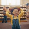 little girl having fun at the library 