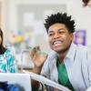 Students in a classroom working and engaging together with no cell phones