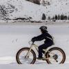 Kid riding a fat bike in the snow outside of Seattle in Methow Valley, a fun winter sport activity for families