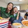 mom and son having fun watching the Super Bowl