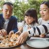 Family enjoying pizza at one of the best Seattle pizza places