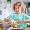 child washing dishes