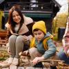 family at a rustic cabin